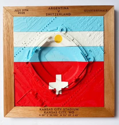 A square wooden framed wall art piece featuring a 3D relief map of Kansas City Stadium overlaid with the Argentina and Switzerland flag colors. The top text reads 'ARGENTINA v SWITZERLAND', 'JULY 11TH 2026', 'QUARTERFINALS', and the botto reads 'KANSAS CITY STADIUM KANSAS CITY, MO' with coordinates below.
