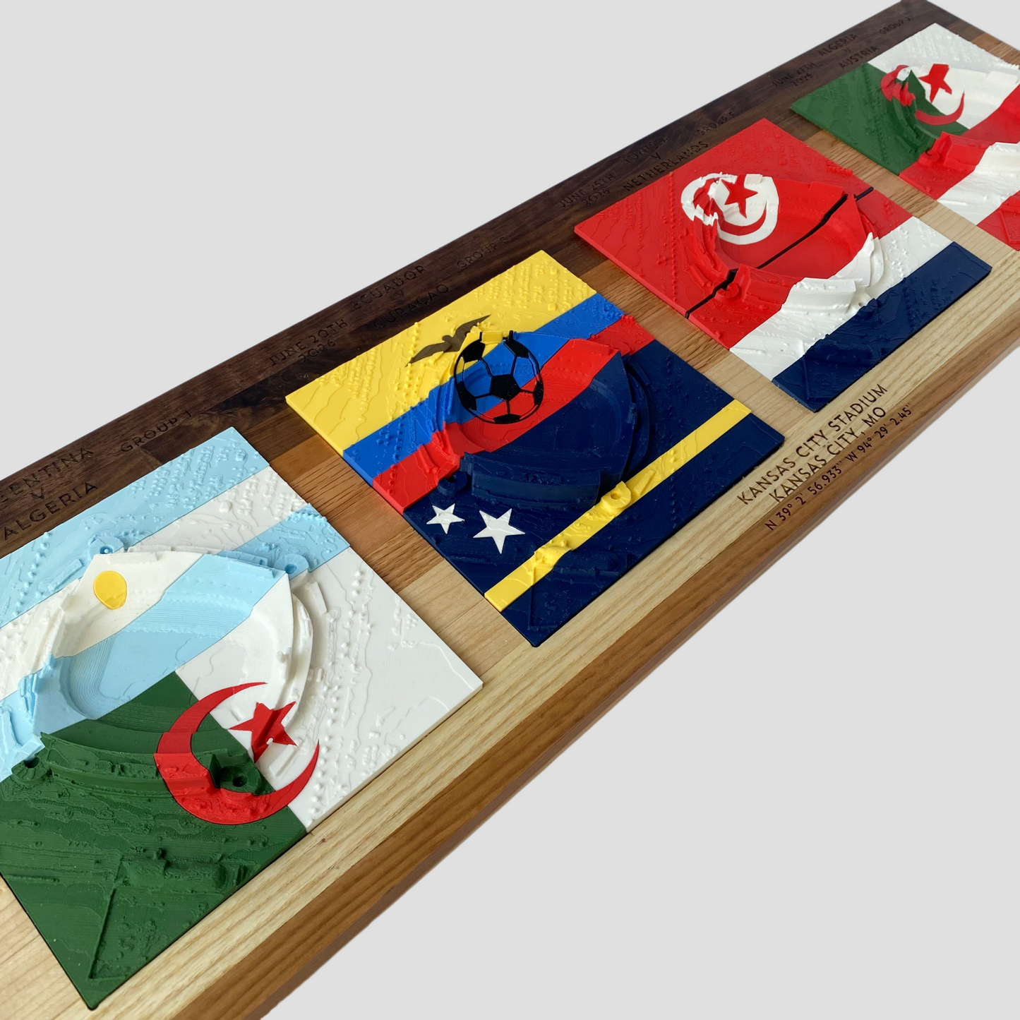 Decorative wall art with embossed flags on a wooden board.