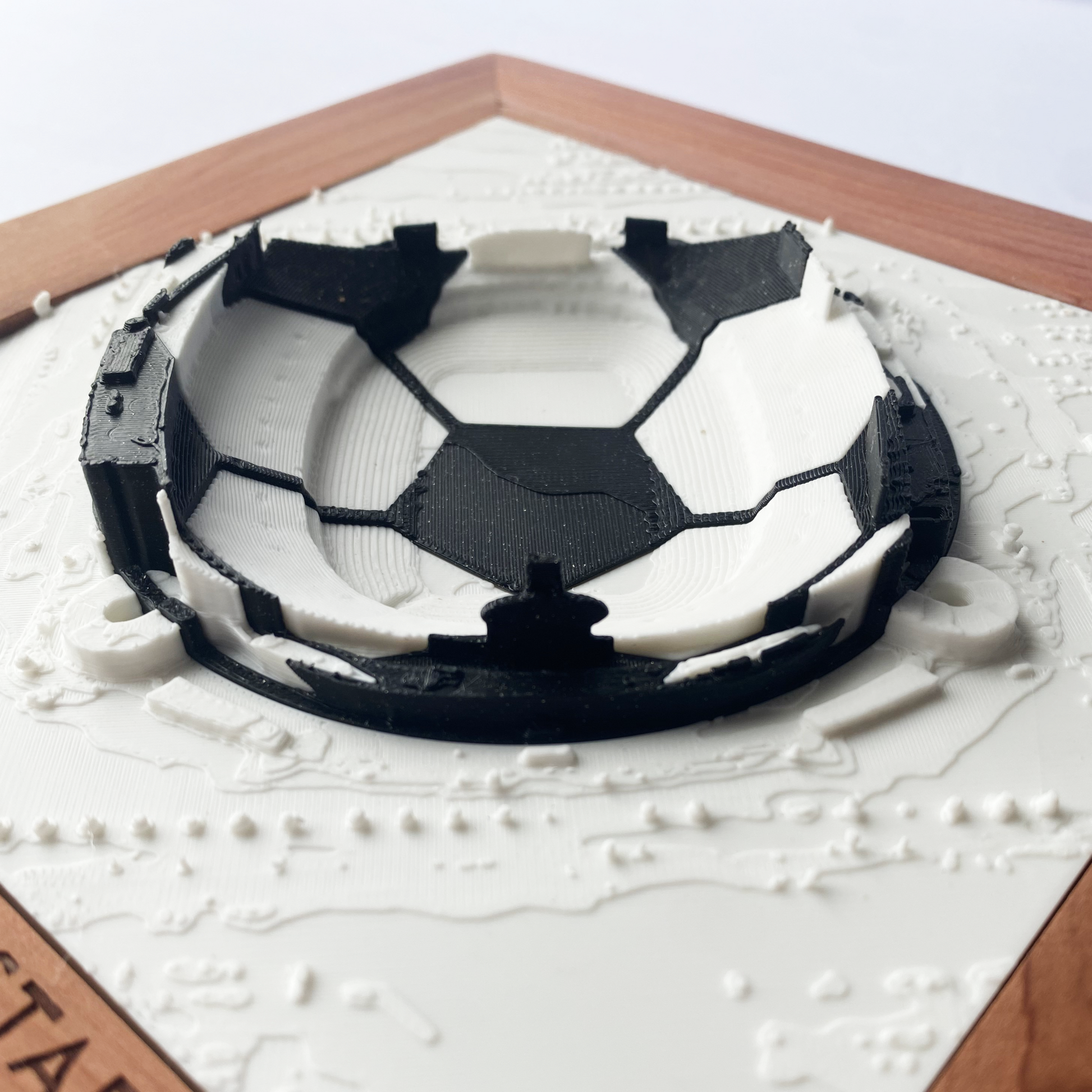 Framed 3D rendering of Arrowhead Stadium with round black and white soccer ball inlay 